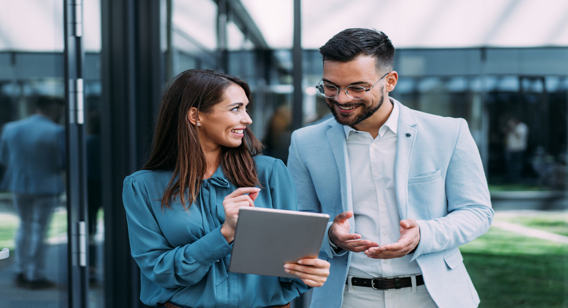 Woman speaking with a man over a tablet