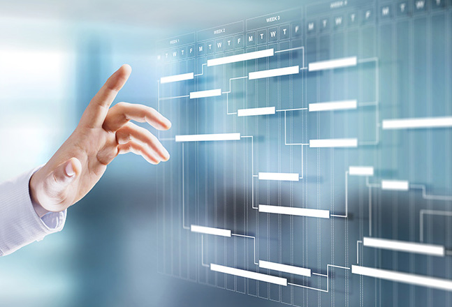 man's finger pointing at a holographic calendar